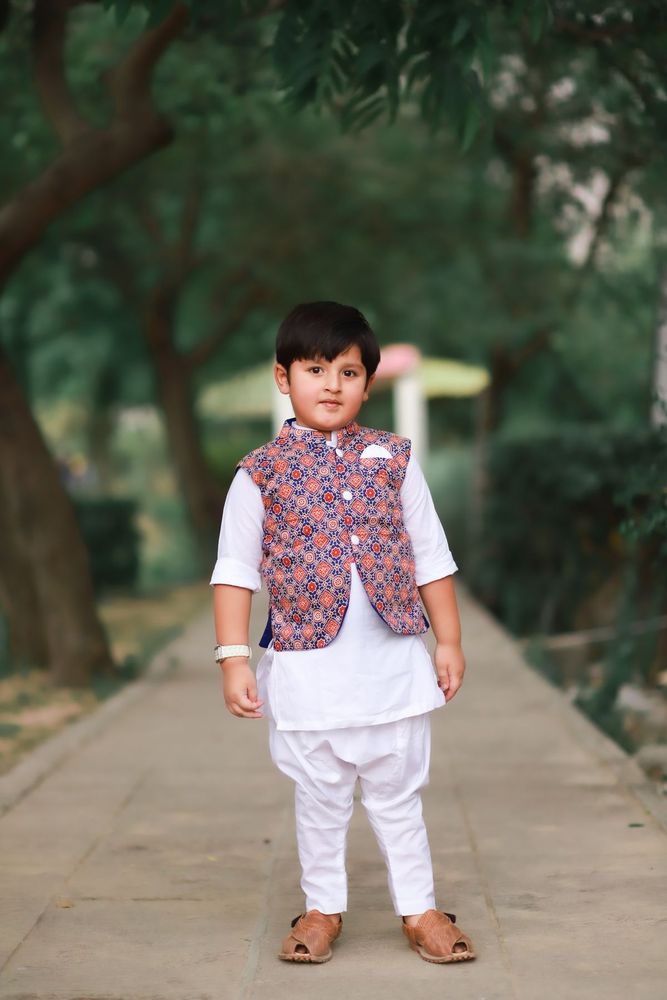 Boy in Nehru jacket and dhoti
