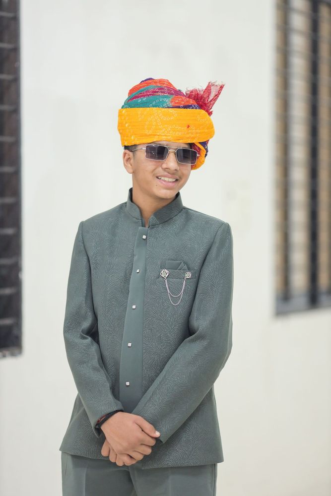 Boy in bandhgala suit and safa