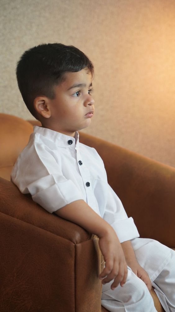 Boy in white kurta pyjama